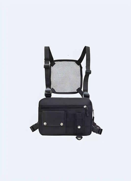 Model wearing a black leather chest bag, viewed from the front. The bag features a smooth leather finish, adjustable straps, and a central compartment with a sleek, minimalist design Canada.