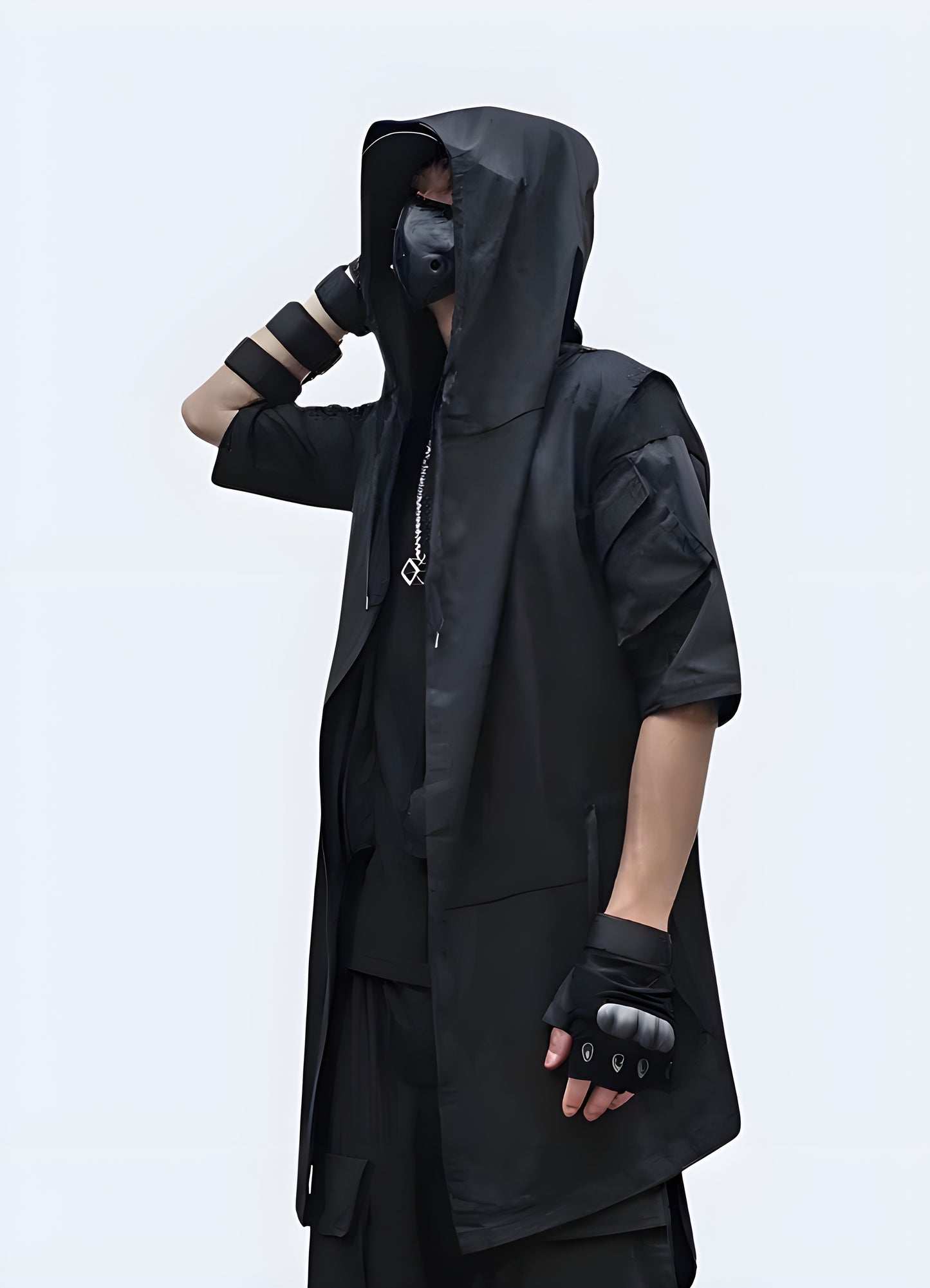 Black sleeveless cloak with a modern, edgy design and functional features, perfect for making a bold fashion statement while navigating Canada's urban landscapes in style and comfort.