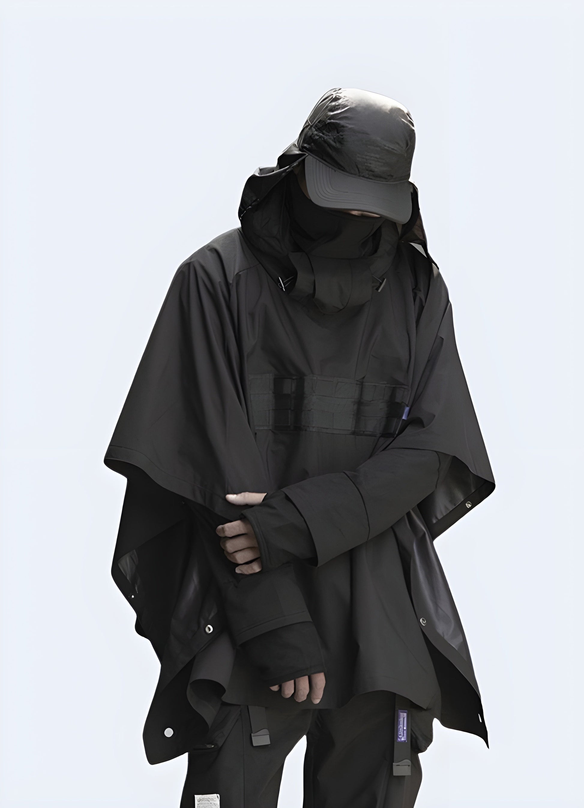 Durable black tactical cloak designed for outdoor adventures and urban exploration, offering versatile protection and functionality in the Canada.