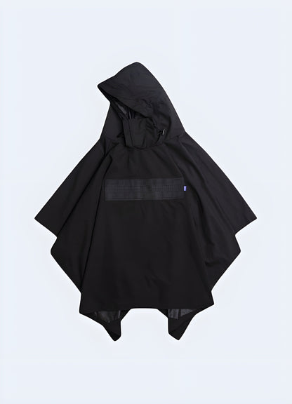 Model showcasing the front view of a black tactical cloak, highlighting its sleek design and adaptable style, perfect for outdoor enthusiasts and urban explorers in the Canada.