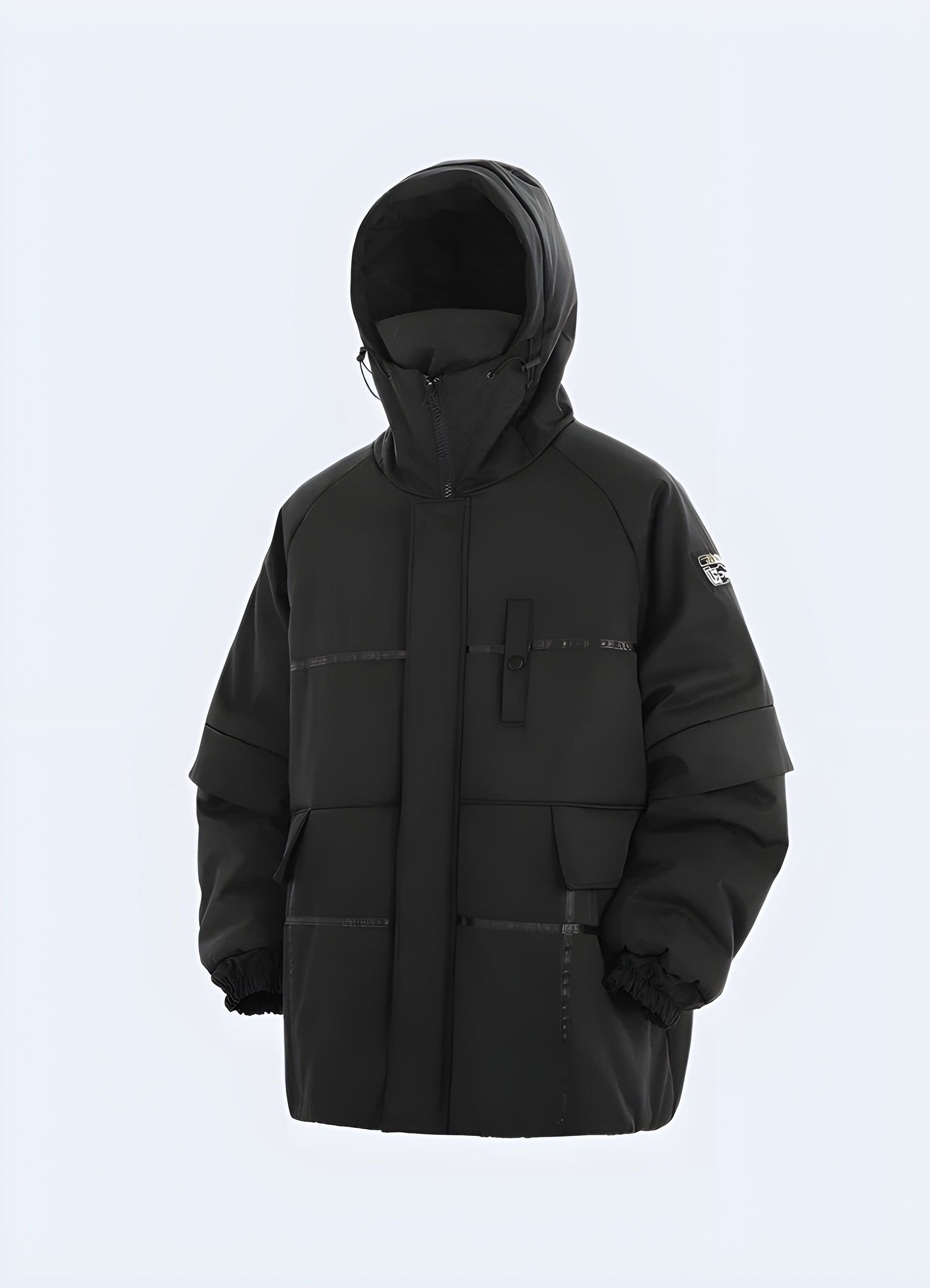 Front view of a black techwear jacket on a model showcasing its streamlined fit, innovative materials, and functional utility pockets, designed for both style and performance in Canada's urban settings.