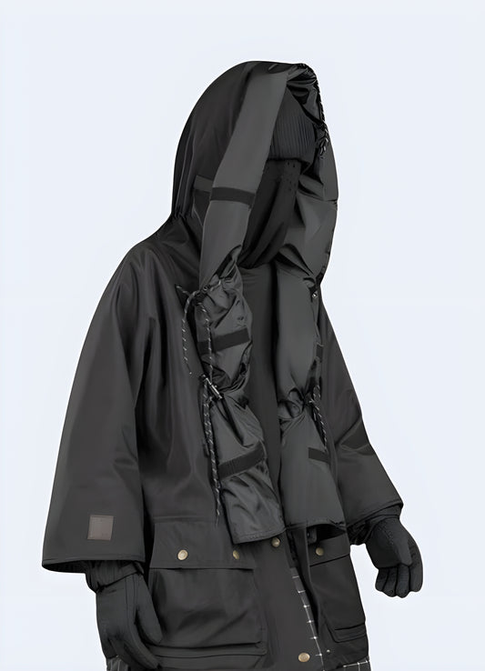 Black techwear Jacket with long folded hood crafted with advanced materials and functional features, ideal for staying comfortable and stylish during Canada's fall season in urban and outdoor settings.