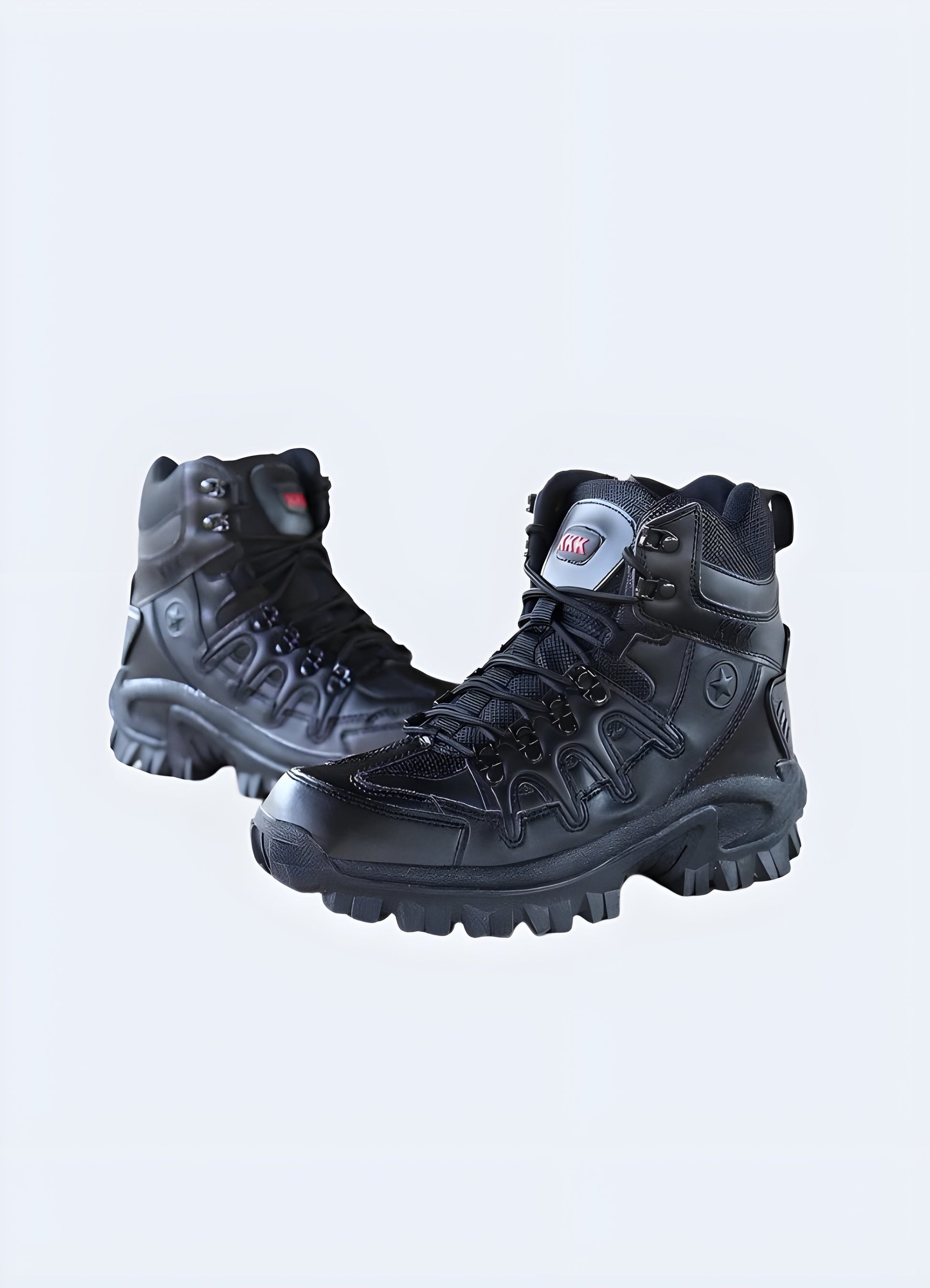 A side view of black waterproof techwear boots showing their rugged design and advanced waterproofing features.