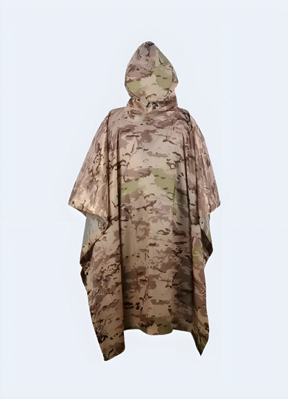 A person wearing a high-performance camo tactical poncho in a snowy Canadian landscape, demonstrating the garment's effectiveness and camouflage in winter environments.