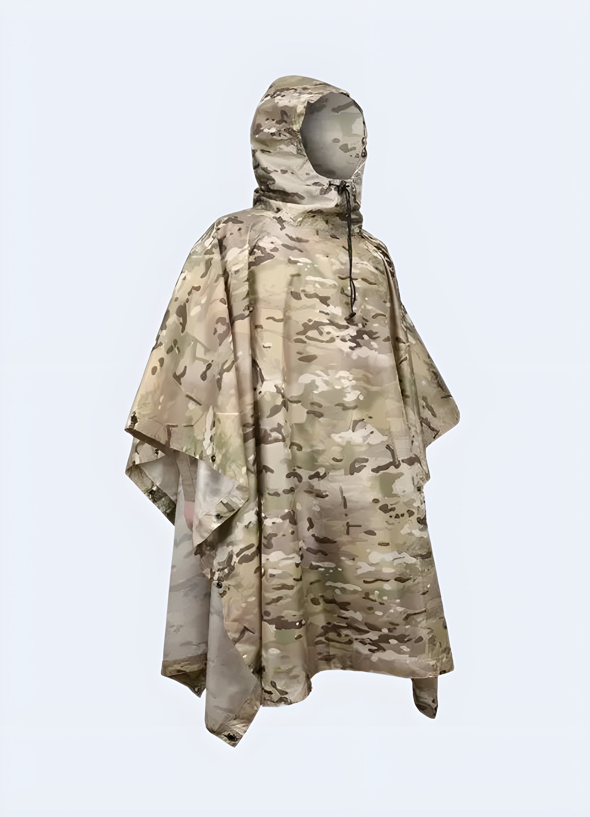 Front view of a person wearing a durable camo tactical poncho in a Canadian desert setting, highlighting the garment's practicality and blending capabilities for arid conditions.