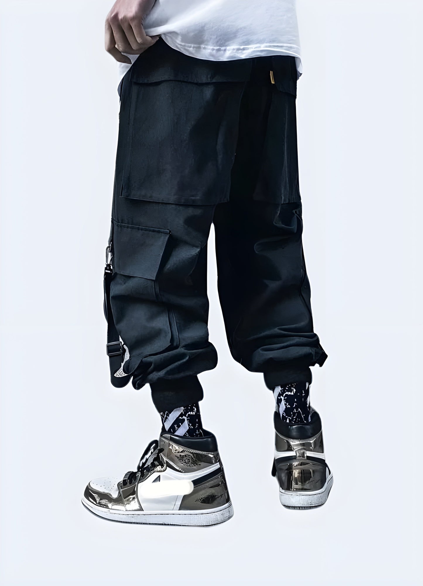 Rear view of man in black techwear cargo pants featuring adjustable straps and pockets, Canada fashion.