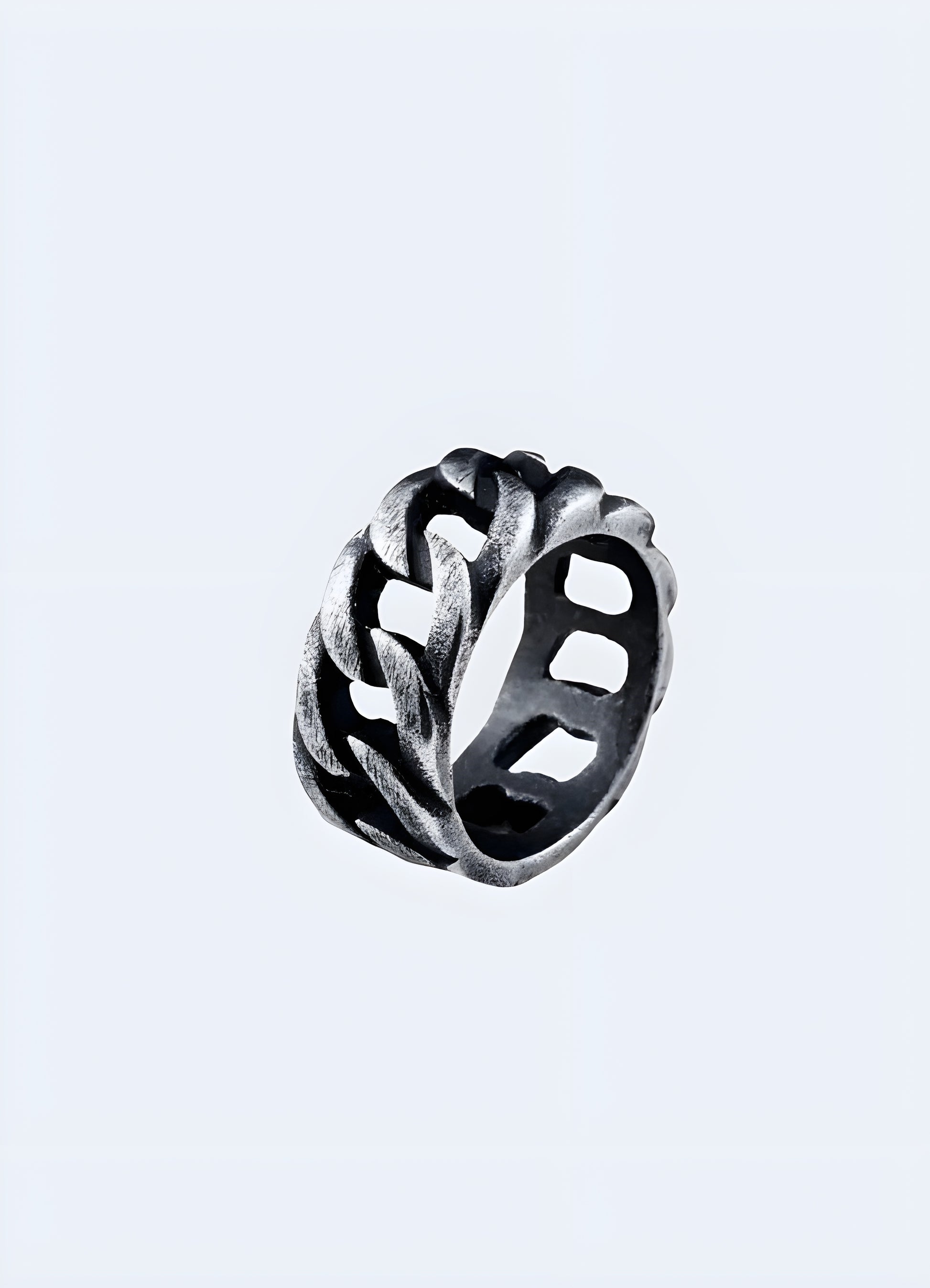 A model showcasing the front and side view of a chain ring, highlighting its detailed links and polished metal finish Canada.