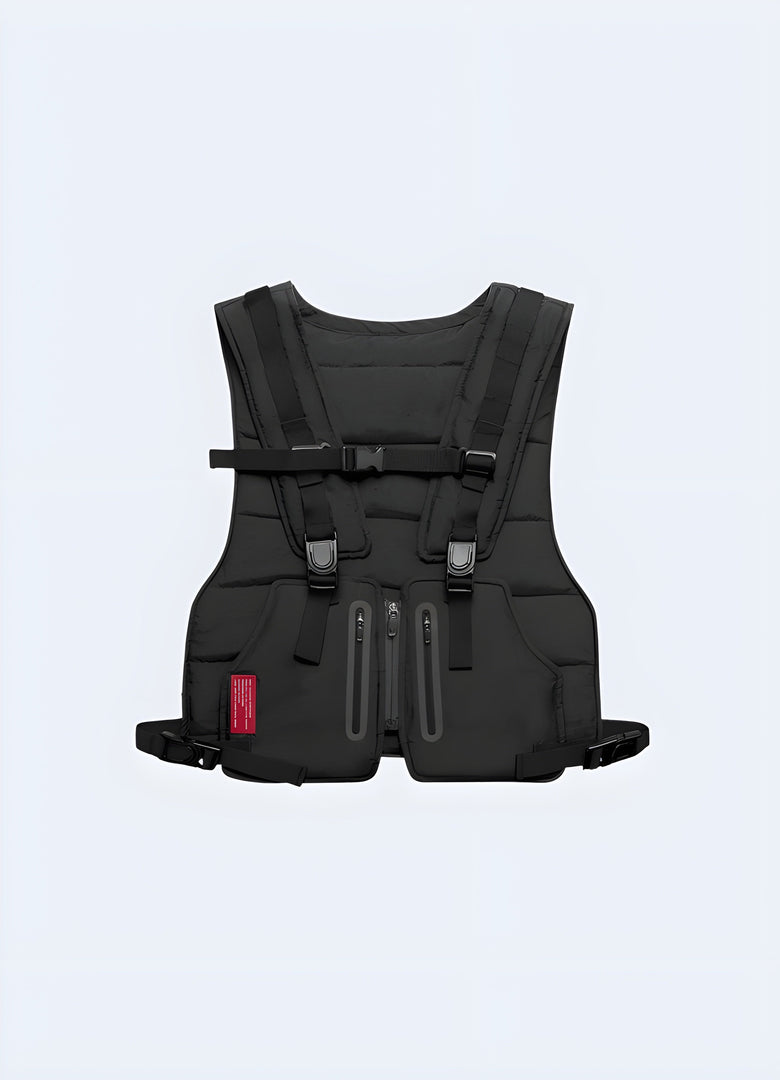 The design is sleek and minimalist, fitting seamlessly over a casual black hoodie. The chest rig is paired with black cargo pants and white sneakers, showcasing a modern, urban look Canada. 