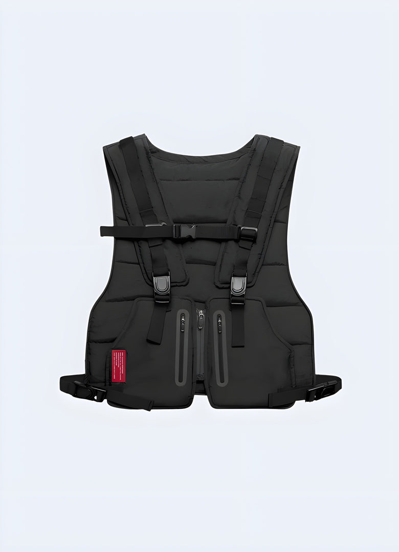 Black chest rig viewed from the front, featuring multiple adjustable straps and several front pockets with buckles or zippers, designed for a streetwear style Canada.