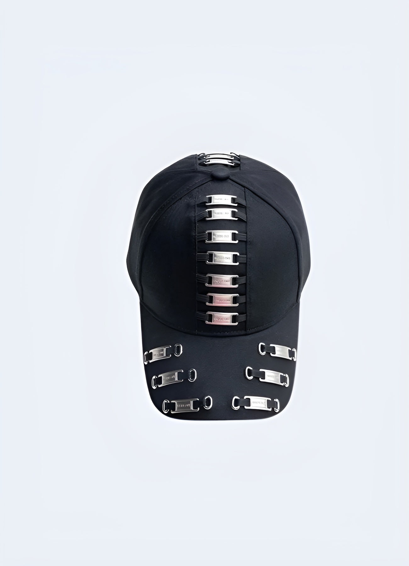 A black darkwear cap featuring metal frame tags, shown from the front to highlight its design. This style is influenced by contemporary Canadian fashion.