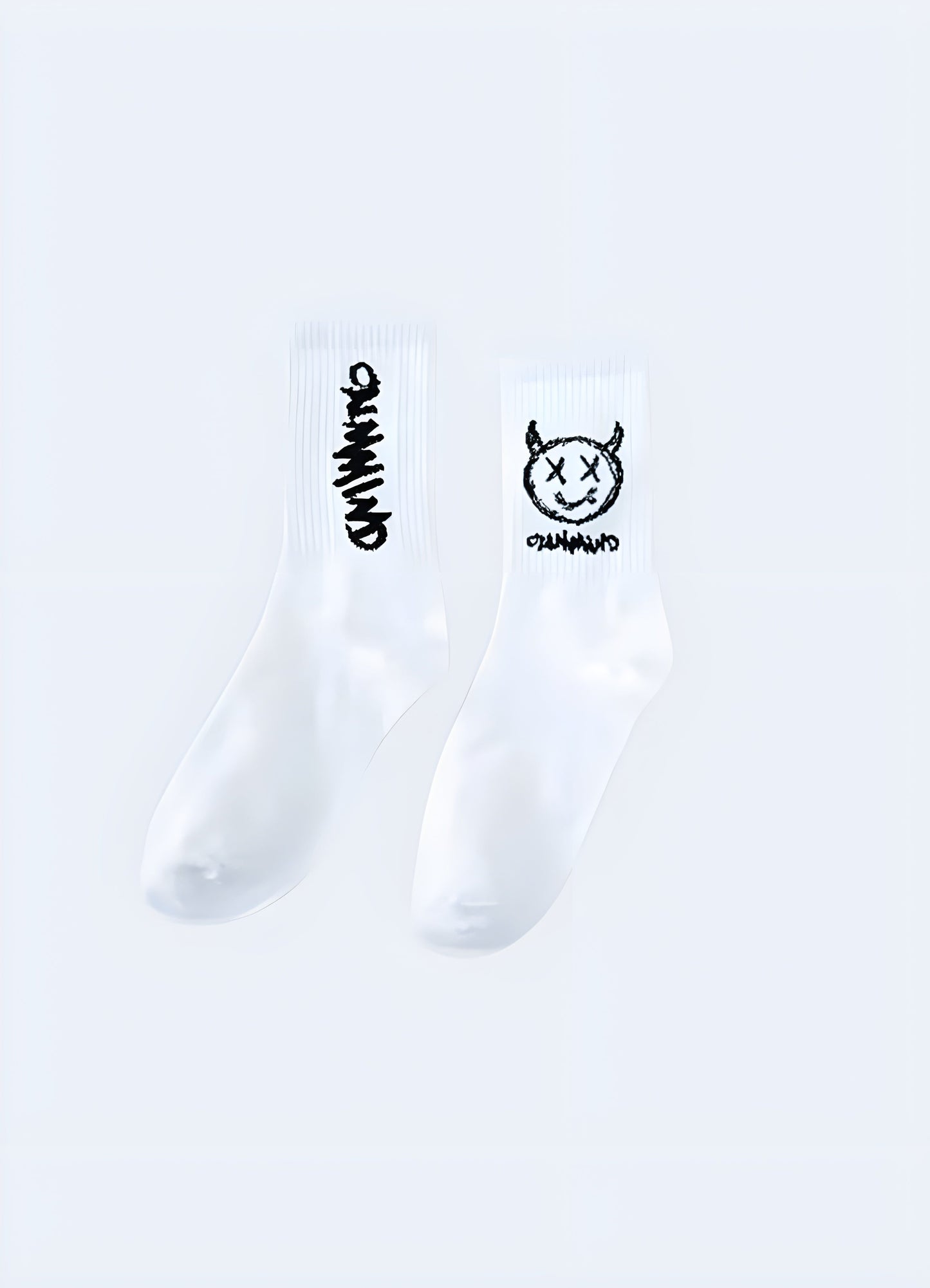 Side view of white demon socks, showcasing the detailed and sinister artwork that captures the attention of Canada consumers seeking unique and bold fashion statements.