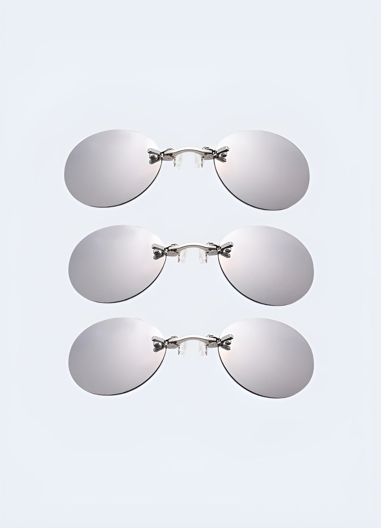 A set of three silver futuristic party glasses, shown from the front, each with distinct, cutting-edge designs Canada.