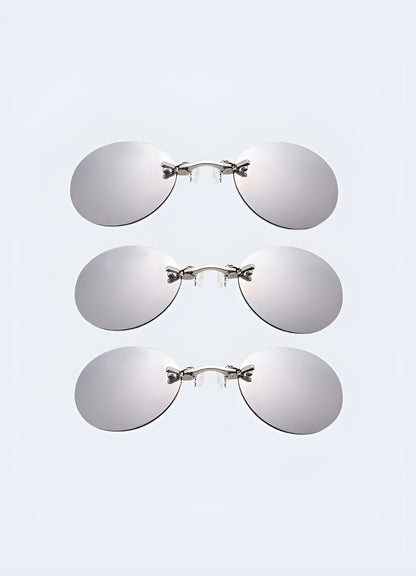 A set of three silver futuristic party glasses, shown from the front, each with distinct, cutting-edge designs Canada.