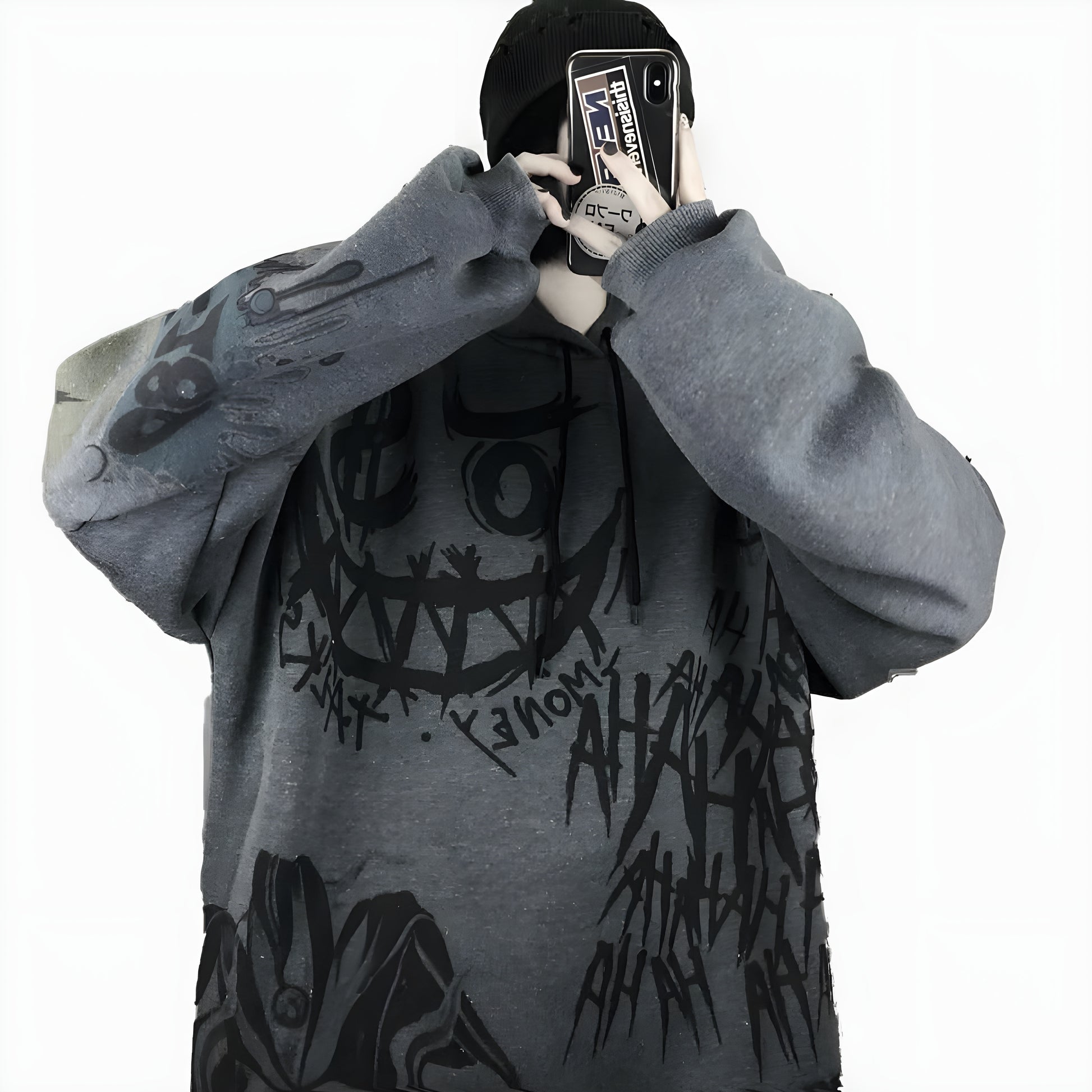 The hoodie features dark, dramatic elements such as intricate Japanese patterns and motifs, combined with a loose, relaxed fit, creating a blend of gothic and streetwear aesthetics Canada.