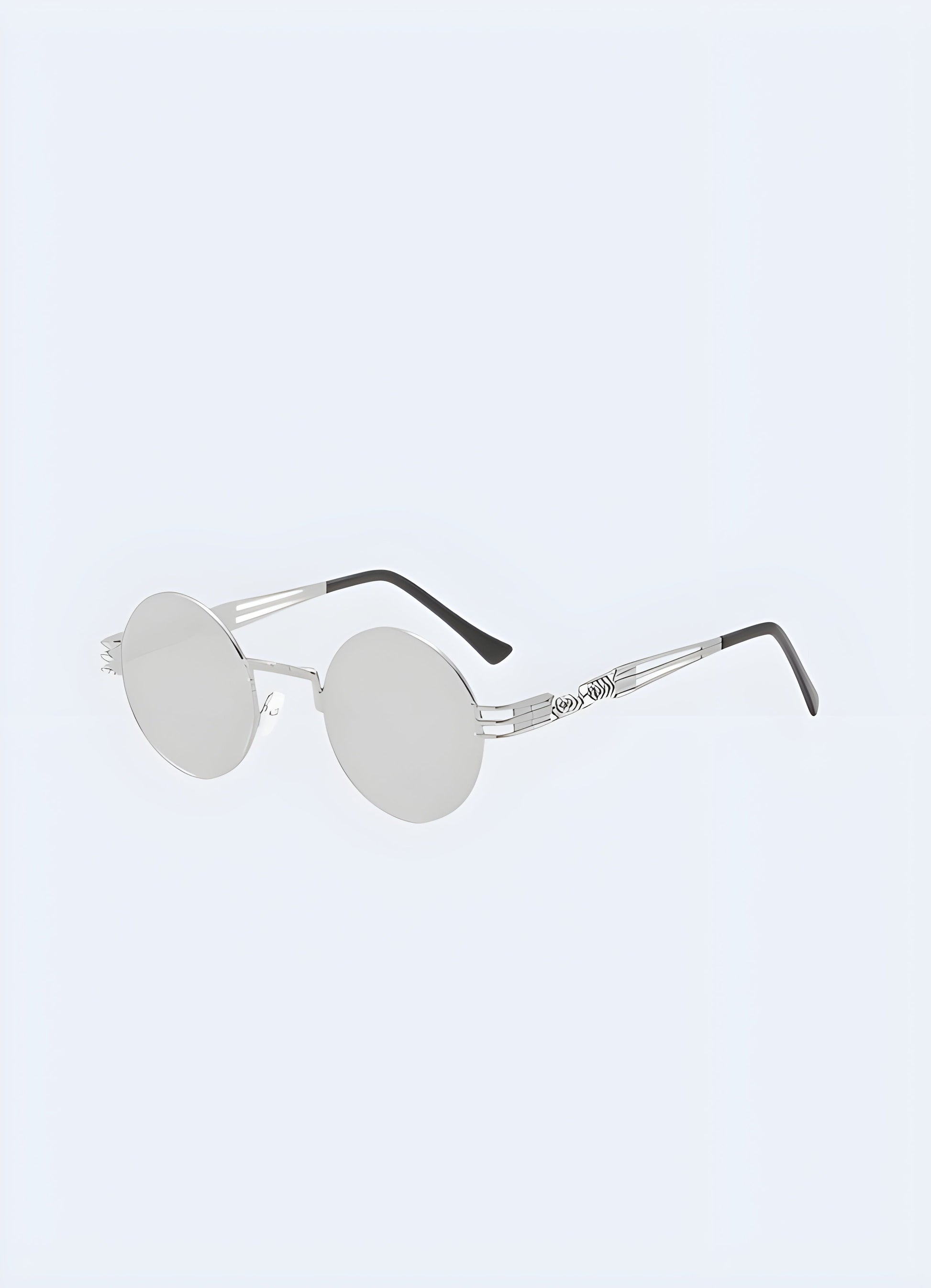 Stylish gothic sunglasses with a sleek silver frame, designed for a bold and edgy look, shown in a front side view perspective, available in the Canada.