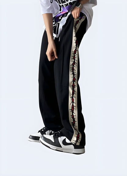 Side view of a man wearing trendy grunge sweatpants, showcasing the garment's loose silhouette and grungy details, perfect for fashion-forward individuals in the Canada embracing the grunge aesthetic.