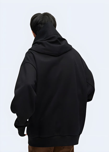 The back shows the unique design and oversized fit, contributing to a trendy and artistic appearance.