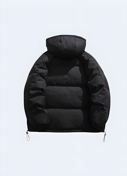 Back view of a sleek black Korean techwear jacket showcasing its innovative construction, adjustable elements, and minimalist aesthetic, ideal for navigating Canada's urban landscapes in style and comfort.