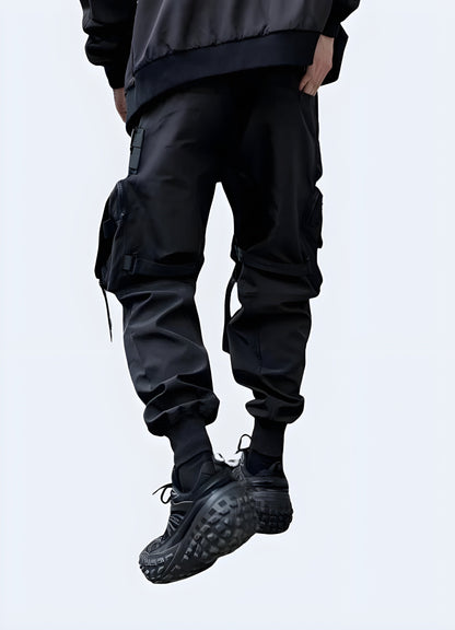 Back view of a man wearing genuine outdoor technical pants, showcasing the garment's iconic silhouette and practical pocket placement, perfect for fashion enthusiasts in the Canada looking for a bold, military-inspired statement piece.