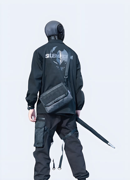 The shoulder bag complements the techwear outfit, emphasizing both practicality and style.