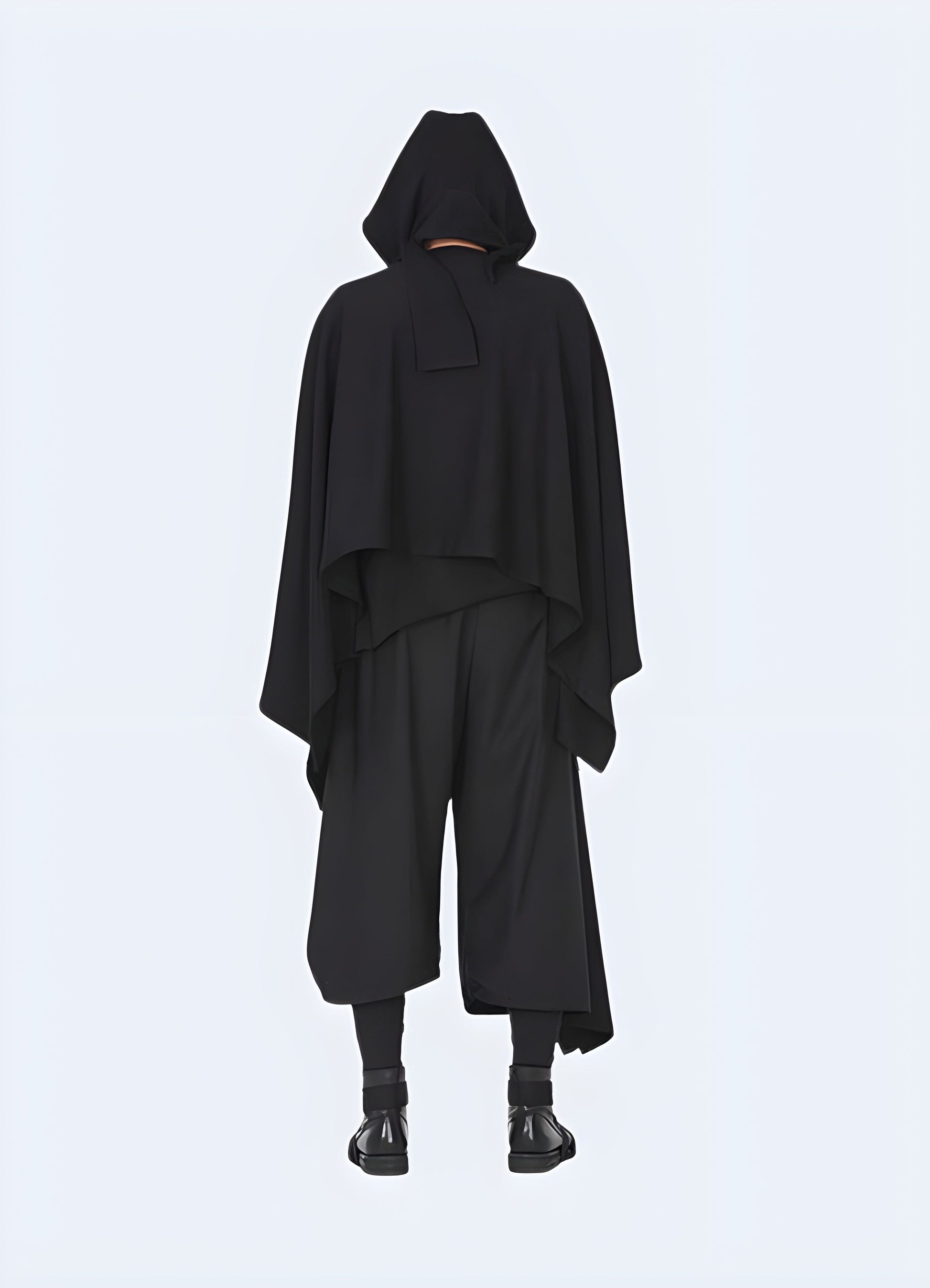 Back view of a man wearing a batwing darkwear cloak, showcasing its rugged construction and practical features for navigating various environments in the Canada.