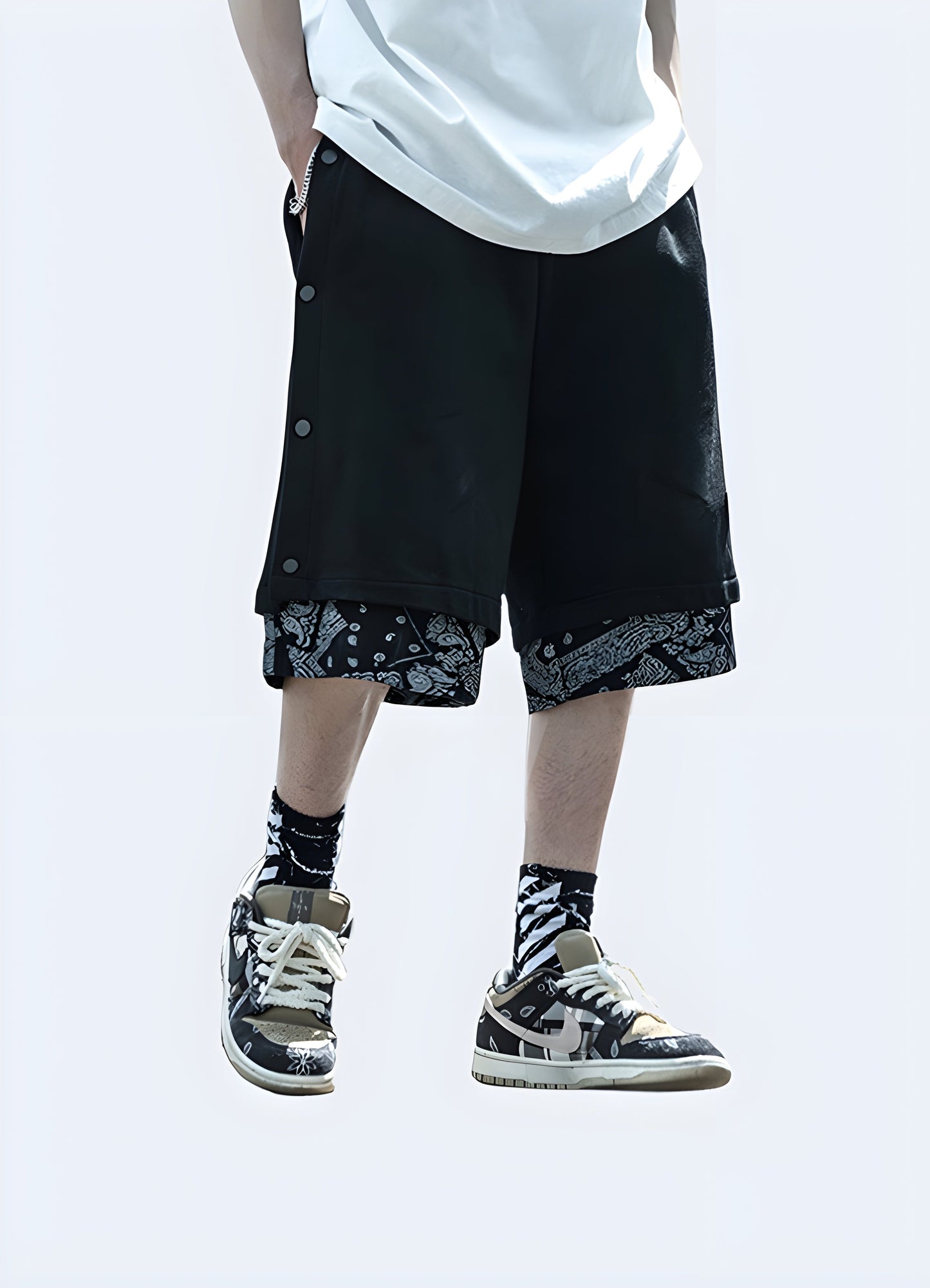 Front view of a man wearing black and white bandana shorts, showcasing the eye-catching design and stylish aesthetic, ideal for the fashion-forward individual Canada.