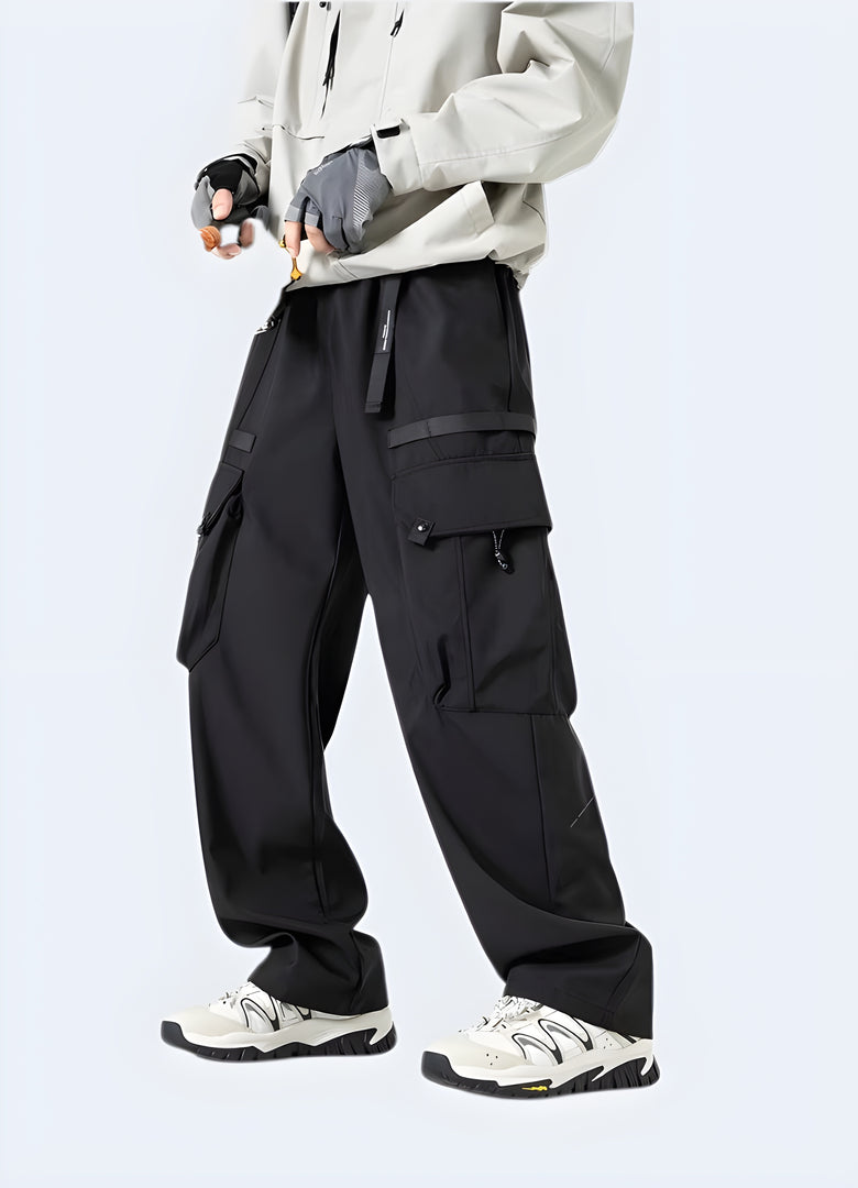 Man wearing black baggy joggers in the Canada, showcasing the loose and stylish design from the right side view, ideal for those seeking comfort and trendy style.
