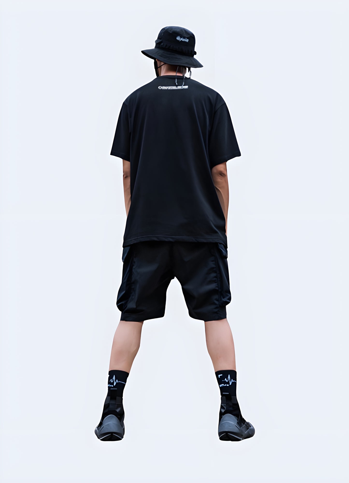 Front view of a man wearing black cargo shorts, showcasing the classic design and comfortable fit, ideal for everyday wear in the Canada.