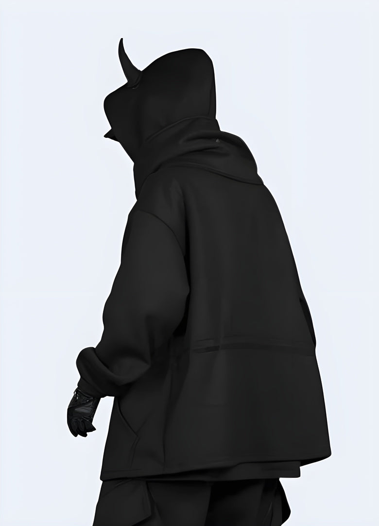 Back view of a man modeling a trendy black hoodie featuring eye-catching horn details, ideal for alternative fashion in the Canada.