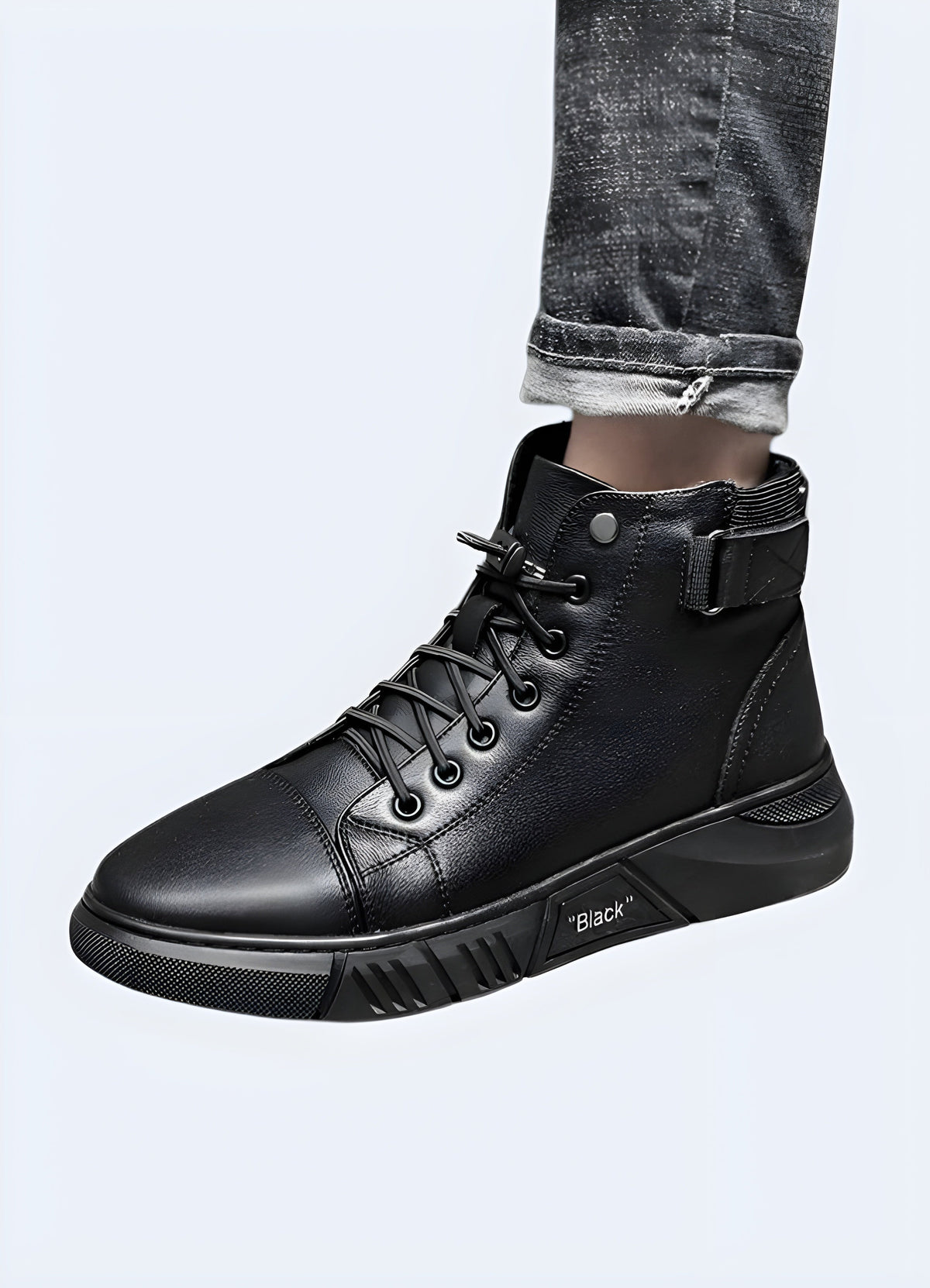 Black leather high top sneaker detail, plain leather panels from toe to collar with no logo blocking