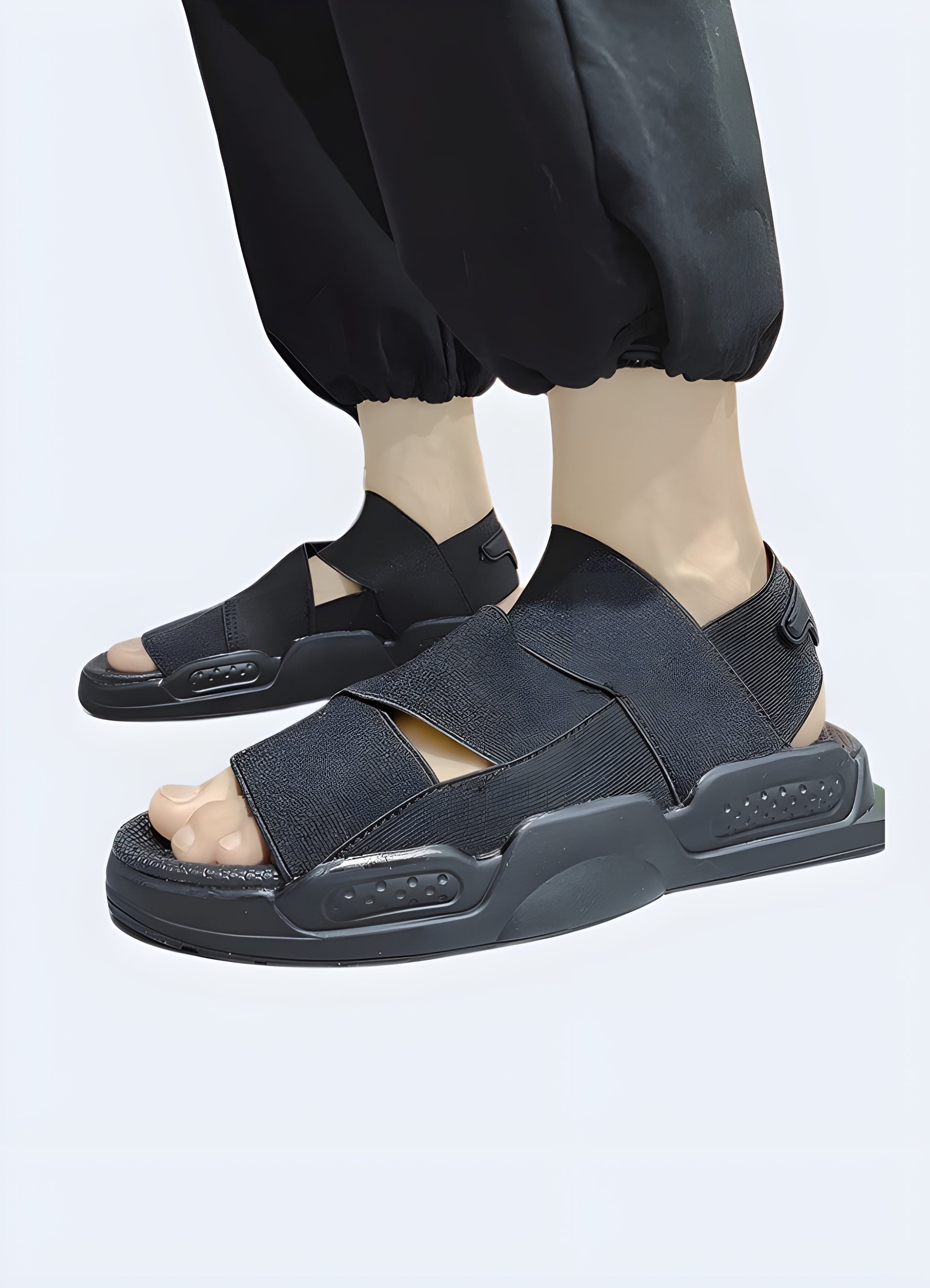 Man wearing black ninja sandals, side view, available in Canada, showcasing their unique style and comfortable fit.