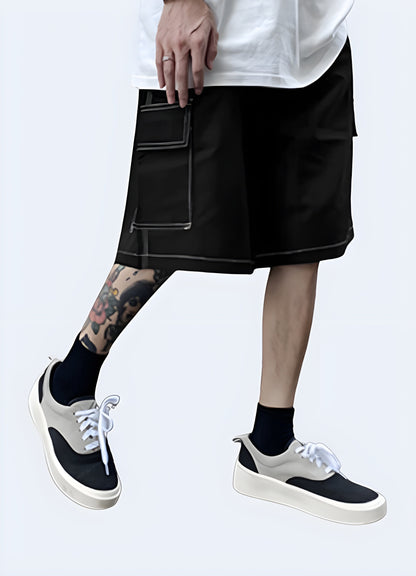 Front side view of a man wearing trendy black shorts with eye-catching white stitching, showcasing the garment's modern silhouette, high-quality construction, and attention to detail that elevate any casual outfit Canada.