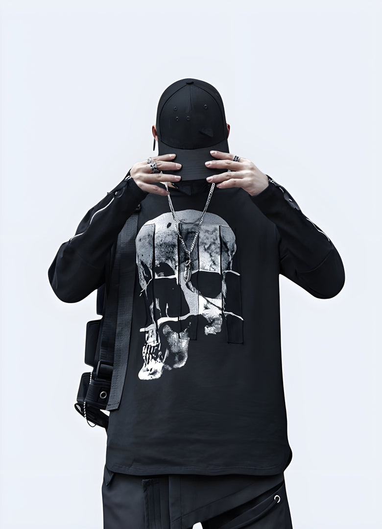 Front view of a man wearing a black skull shirt long sleeve, showcasing its striking design and comfortable fit for alternative fashion enthusiasts in the canada.