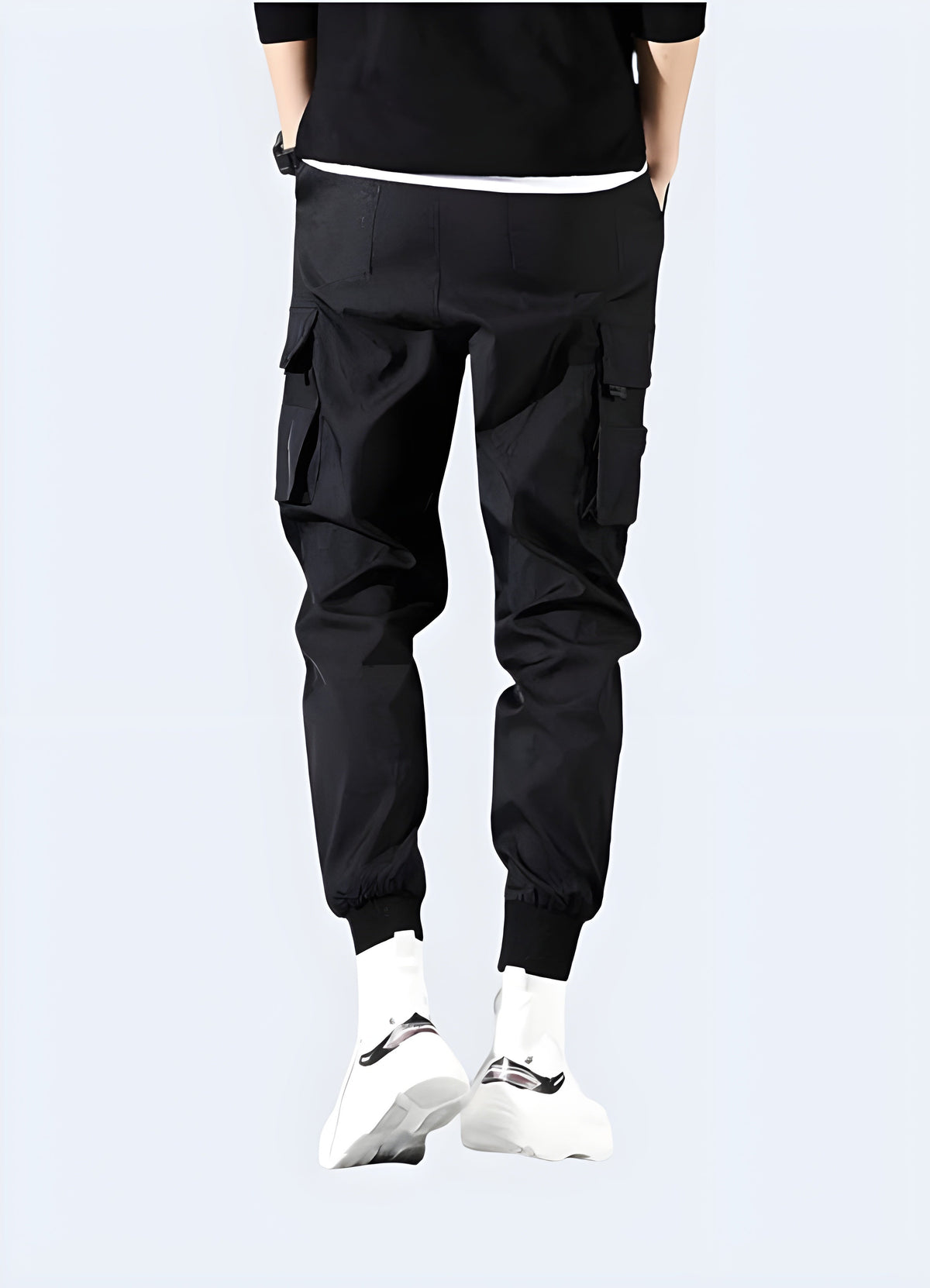 Side view of black unisex cargo pants showing the slim leg line and pocket placement