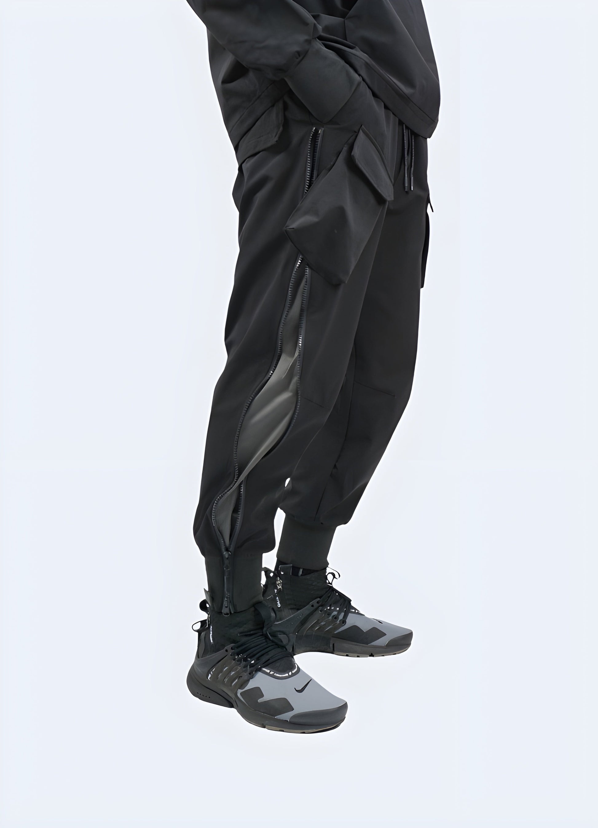 Side view of a man wearing innovative breathable tech pants, showcasing the garment's sleek design and functional features, perfect for athletes and fitness enthusiasts in the Canada.