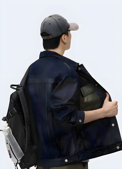 Back view of a man wearing a cargo denim jacket showcasing its multiple utility pockets, durable construction, and versatile style, ideal for storing essentials while navigating Canada's urban landscapes in comfort and fashion.