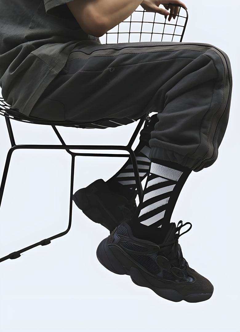 Side view of a man wearing cyberpunk socks, showcasing the bold and futuristic style that's trending in the Canada streetwear scene.