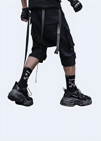 Back view of a man sporting revolutionary drop crotch techwear shorts, highlighting the garment's unique construction, premium materials, and attention to detail that ensure optimal performance and style.