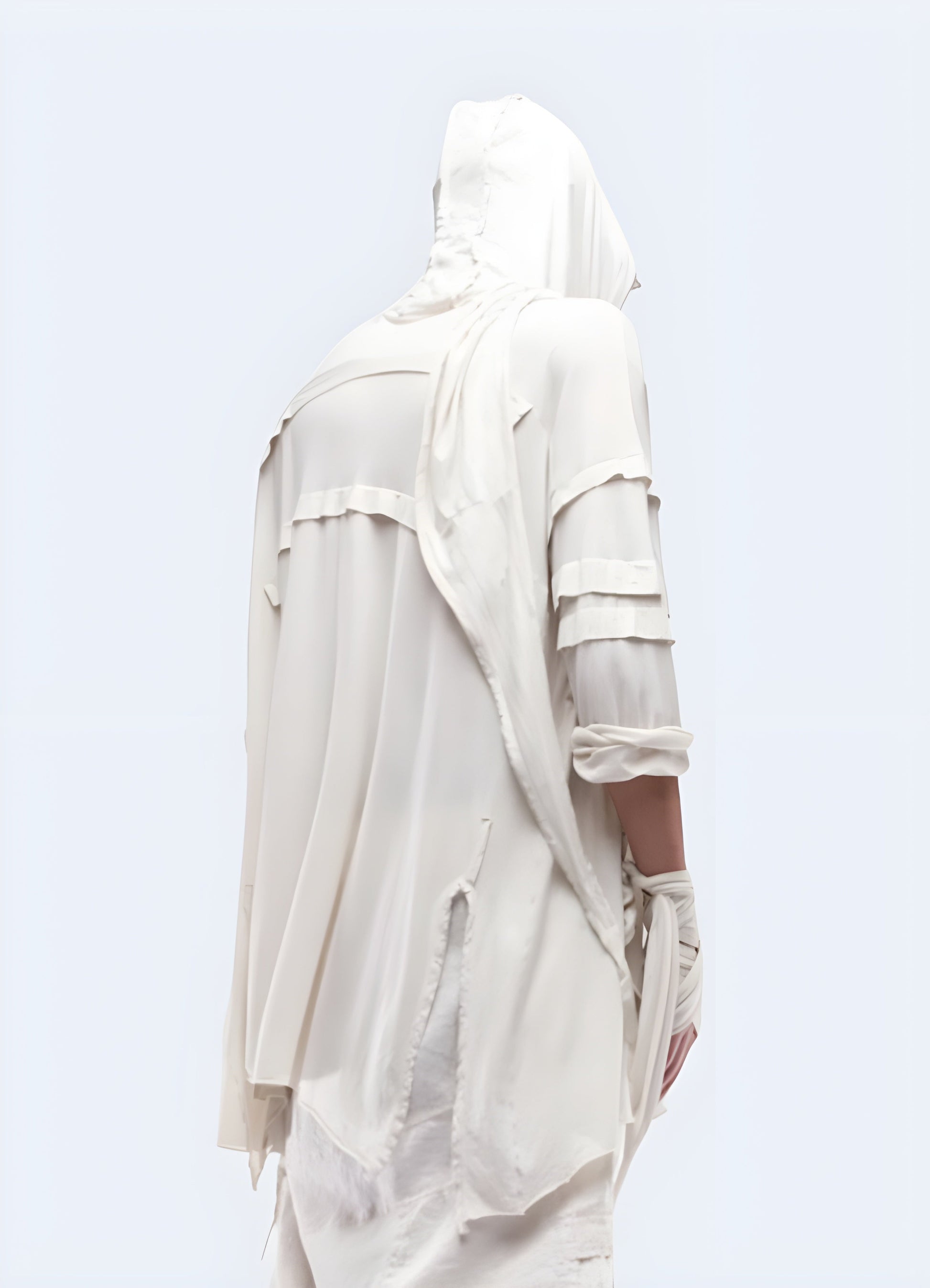 Back view of a man donning a dystopian asymmetric cloak, emphasizing its high-quality construction and attention to detail for a cutting-edge and rebellious style in the Canada.