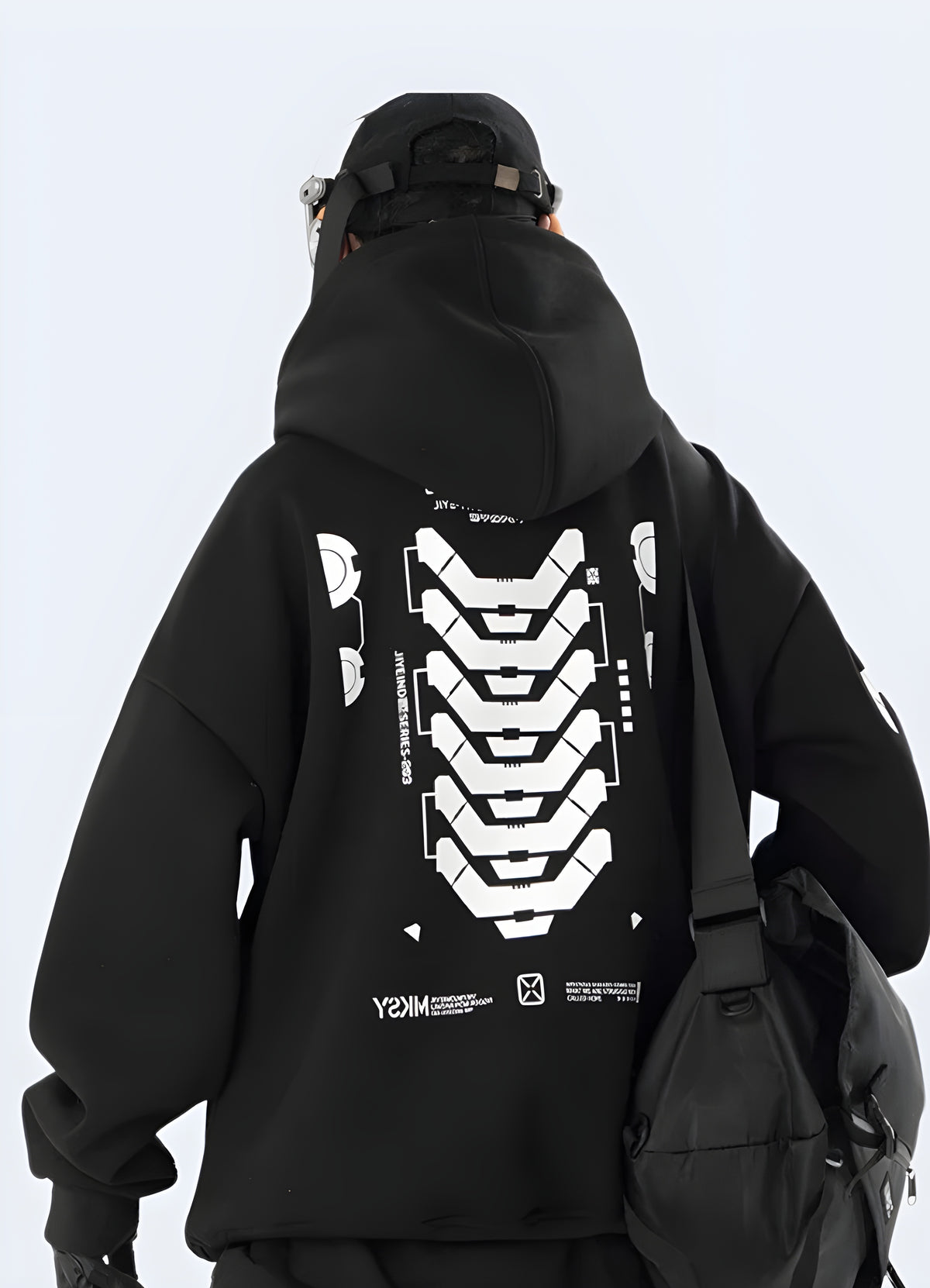Boxy black graphic hoodie showing full hood and squared shoulder line