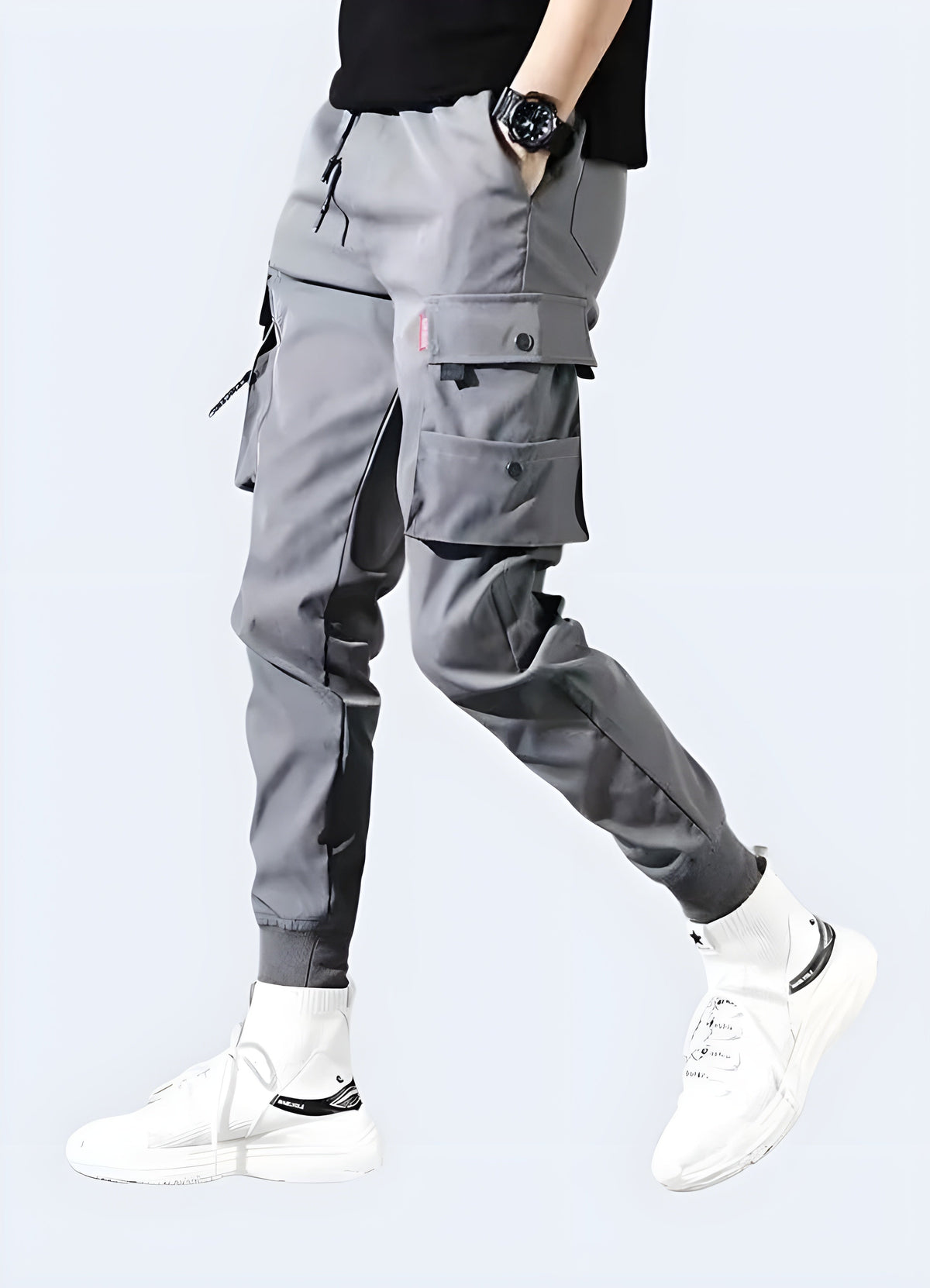 Close detail of the cargo pocket on black slim fit techwear cargo pants