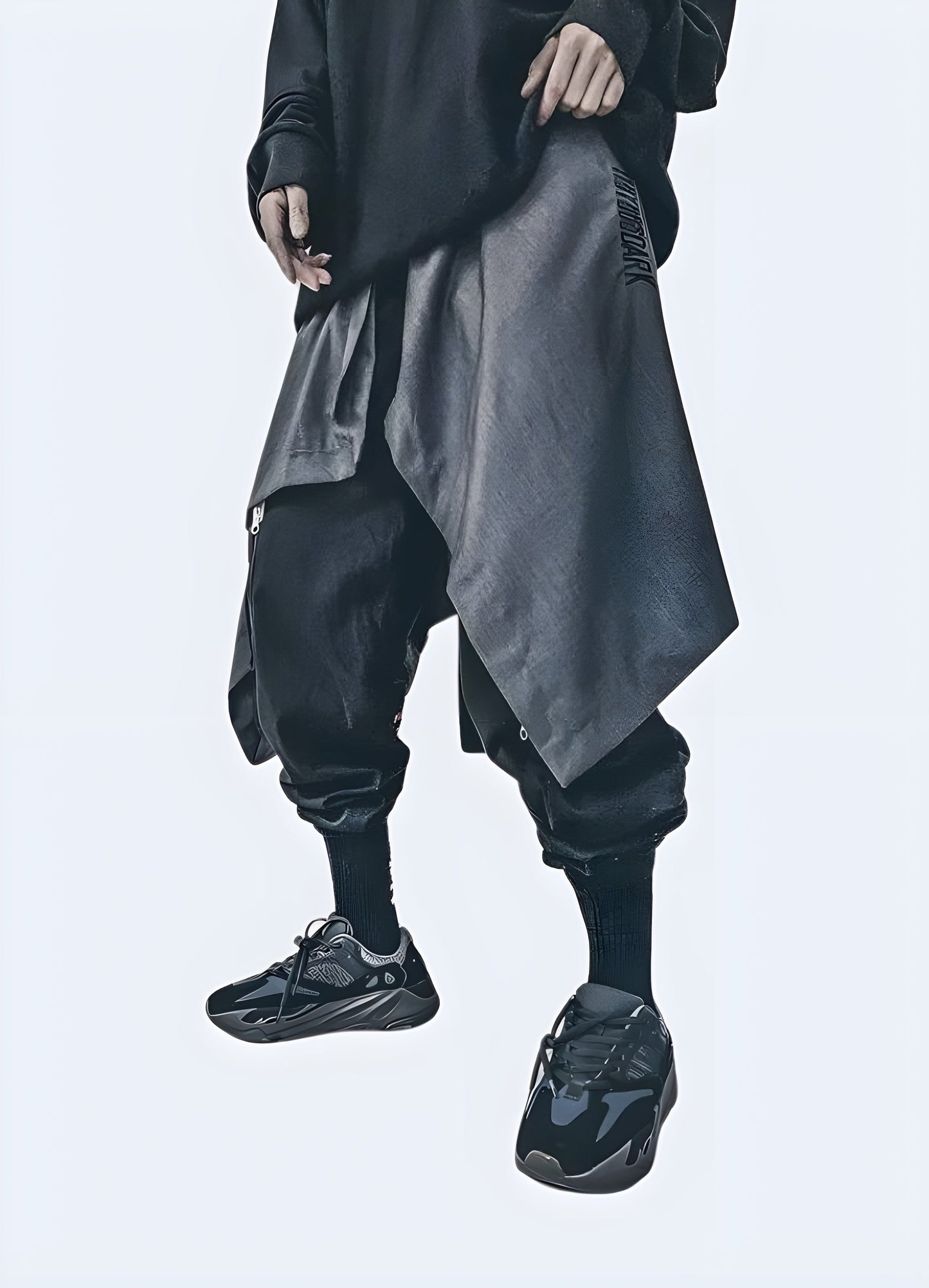 Front view of man wearing grey techwear men samurai skirt, showcasing the comfortable and fashionable design, ideal for the Canada urban fashion scene.