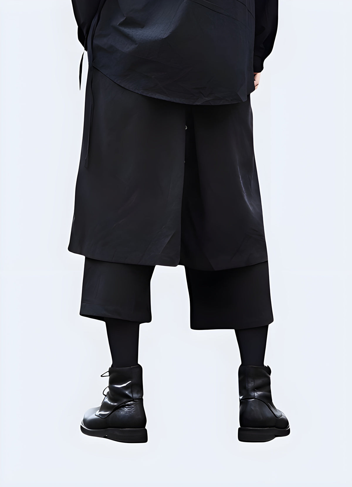 Side view of the hakama cargo pants showing the wide leg opening and long drape
