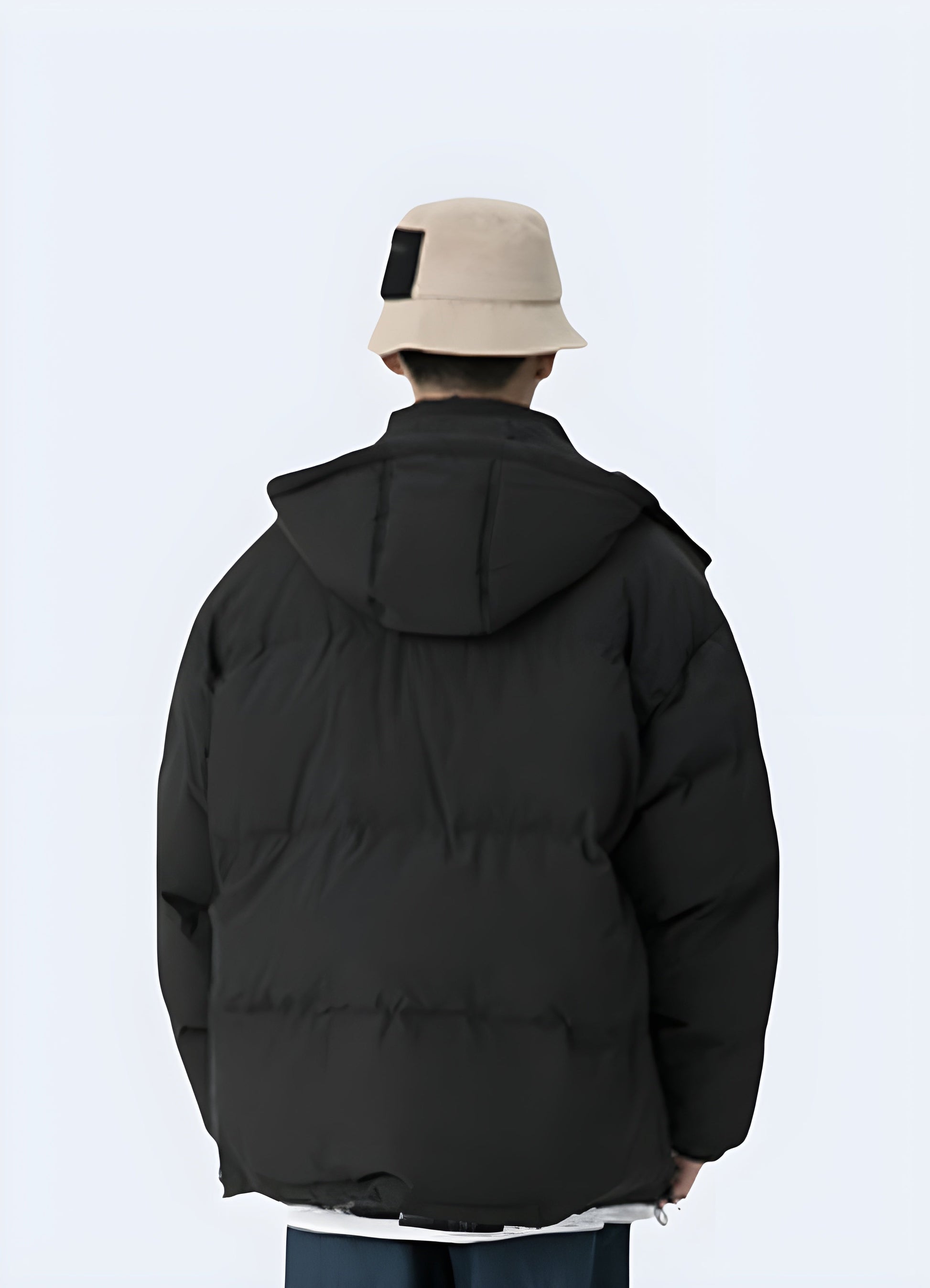 Back view of a man wearing a sleek black Korean techwear jacket, perfect for the Canada urban fashion scene.