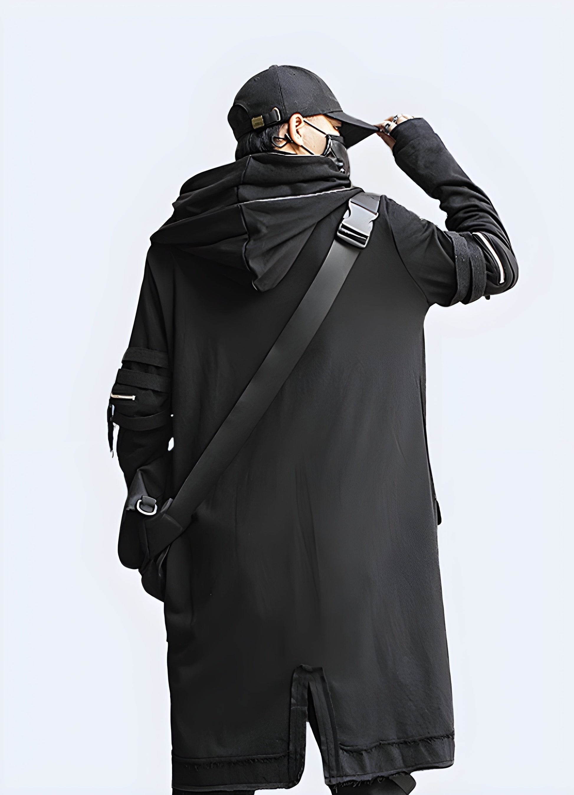 Back view of a man wearing a long techwear jacket, showcasing its unique silhouette and advanced features, perfect for Canada style-conscious consumers seeking a statement piece.