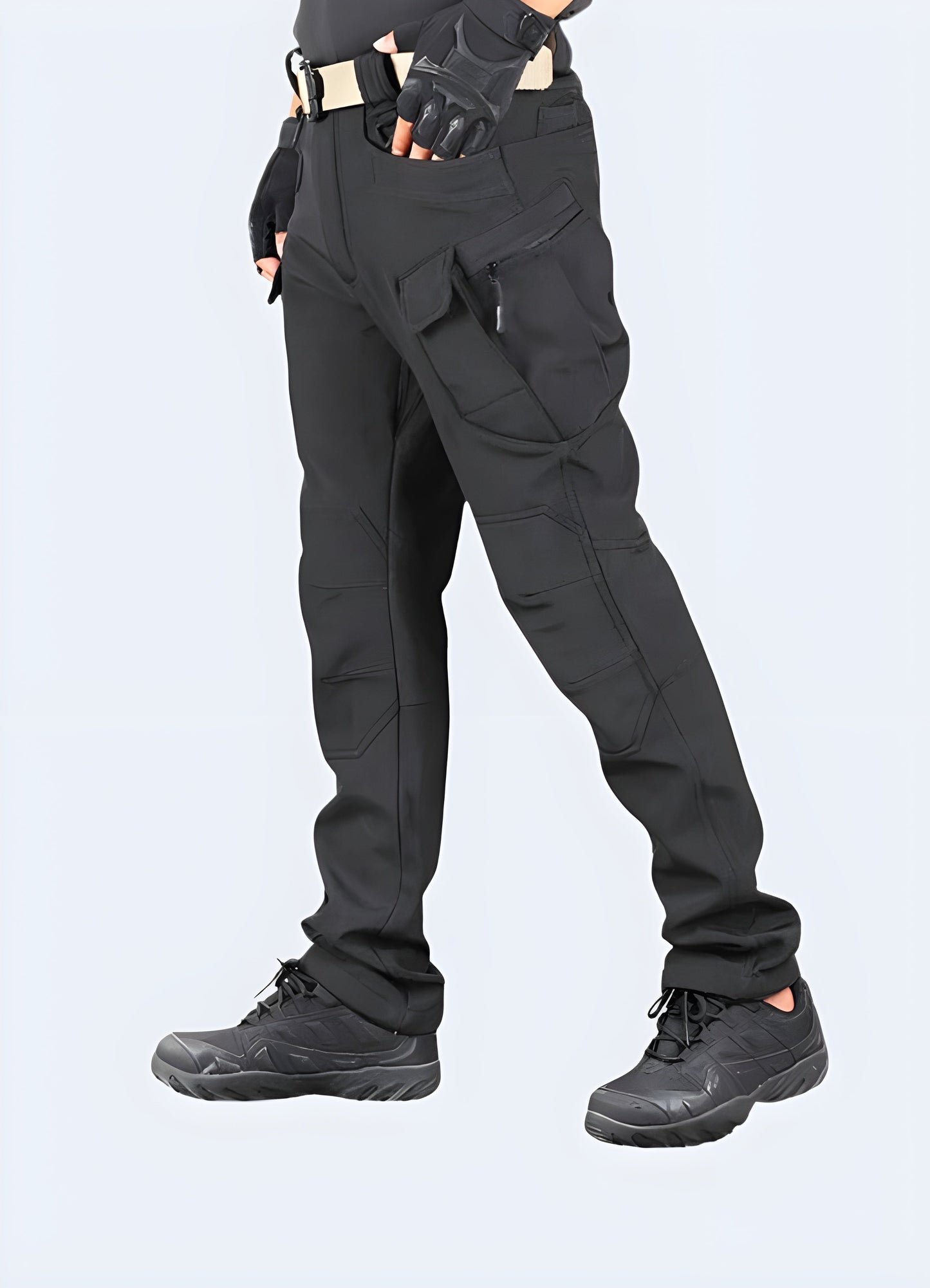 Side view of a man wearing model gorpcore pants, showcasing the modern fit, technical features, and versatile style suitable for various Canadian outdoor activities and everyday wear.