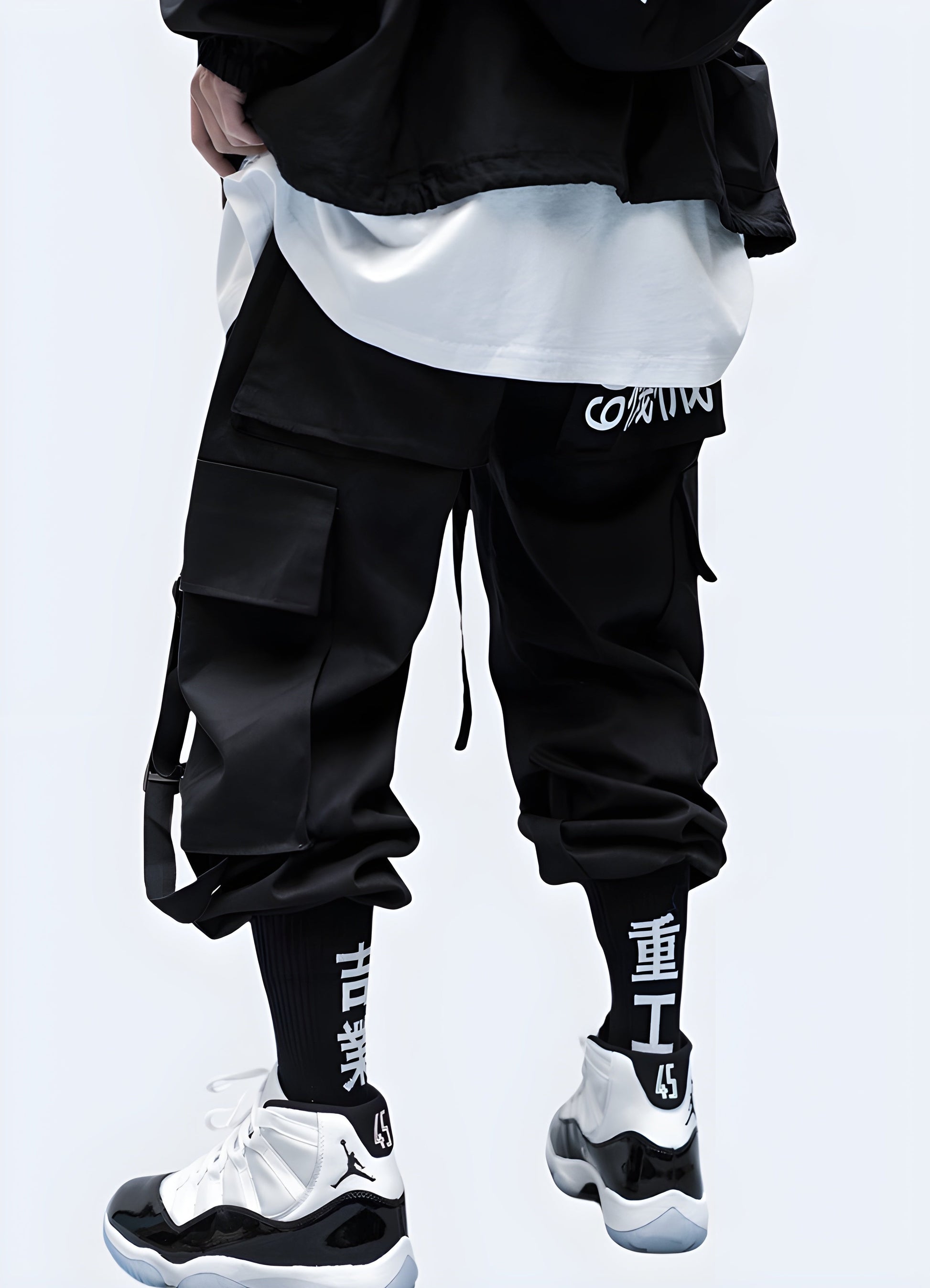 Man wearing black techwear ninja pants, back view, Canada urban style clothing.