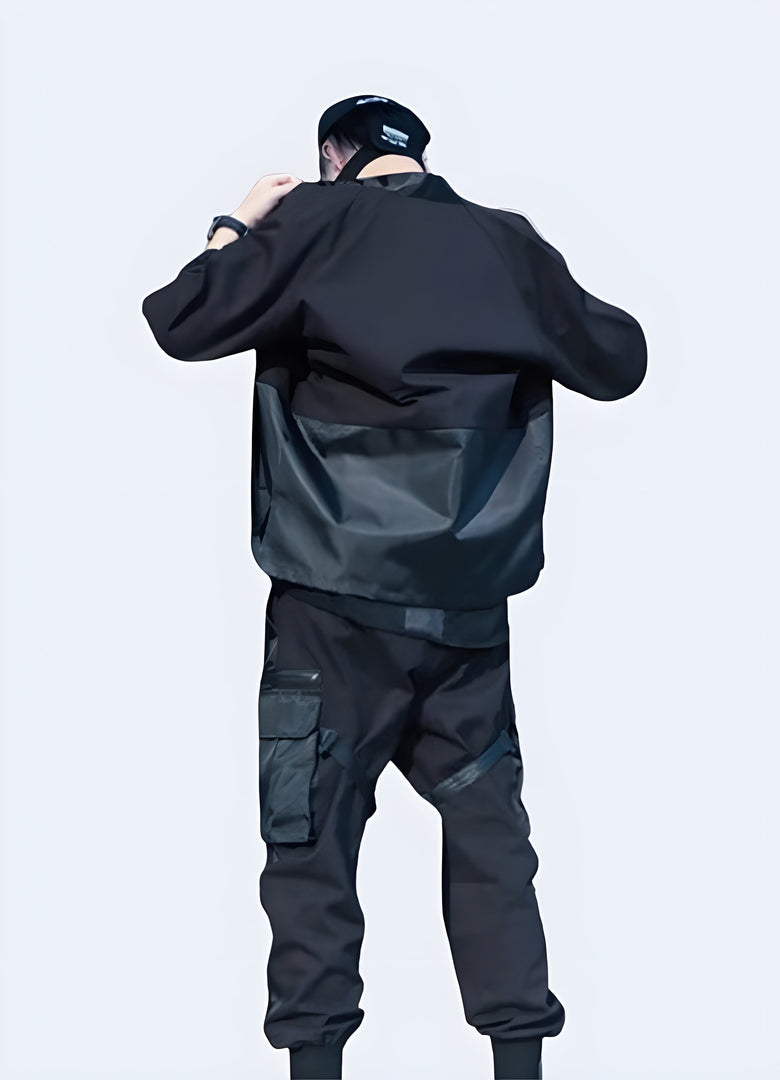 Back view of a man wearing noragi techwear, showcasing the unique silhouette and functional design elements, ideal for the Canada fashion-forward individual seeking a cutting-edge look.