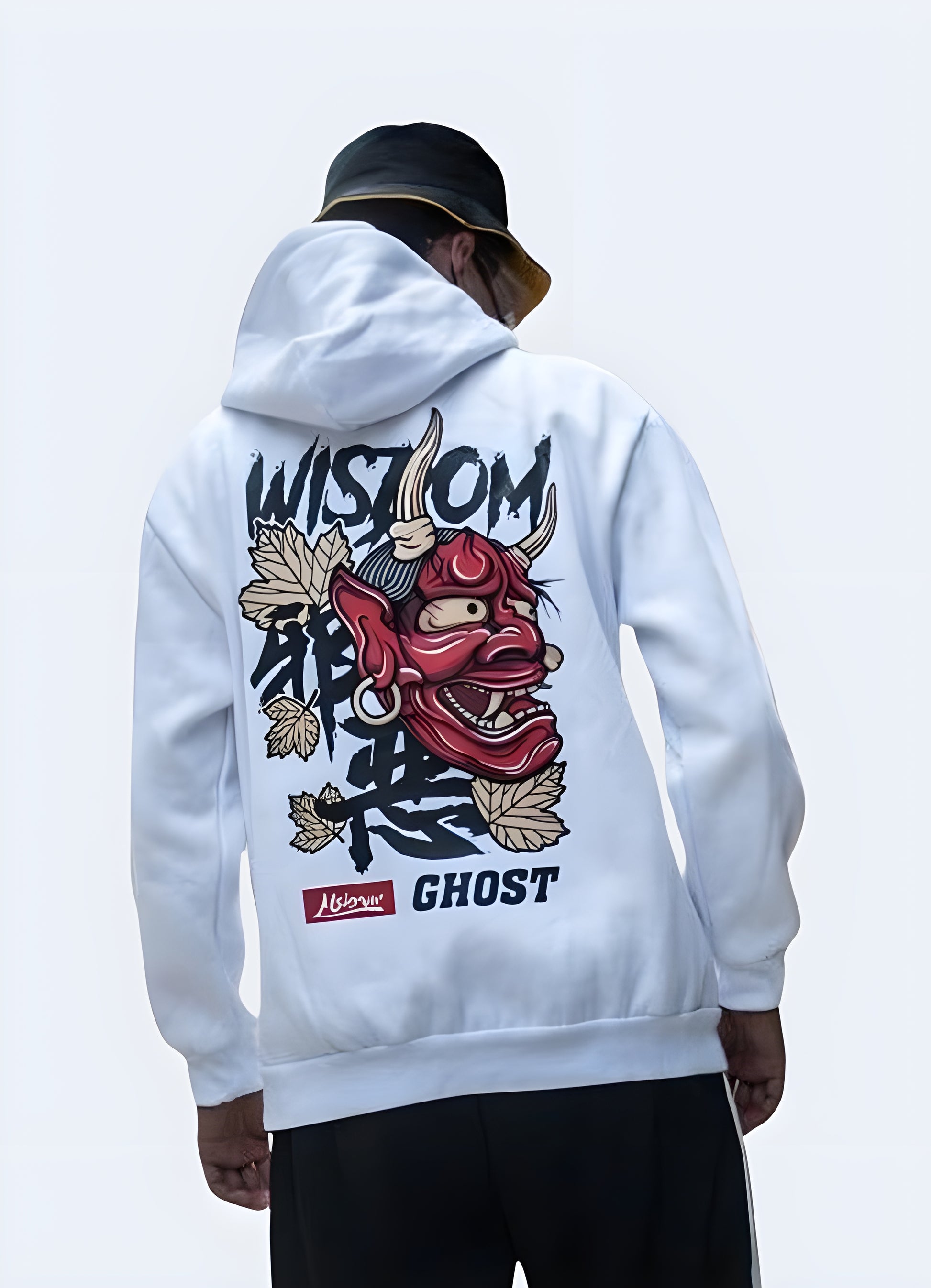 Back view of a man wearing a white hoodie with a red oni demon mask graphic, contrasting against the dark background.