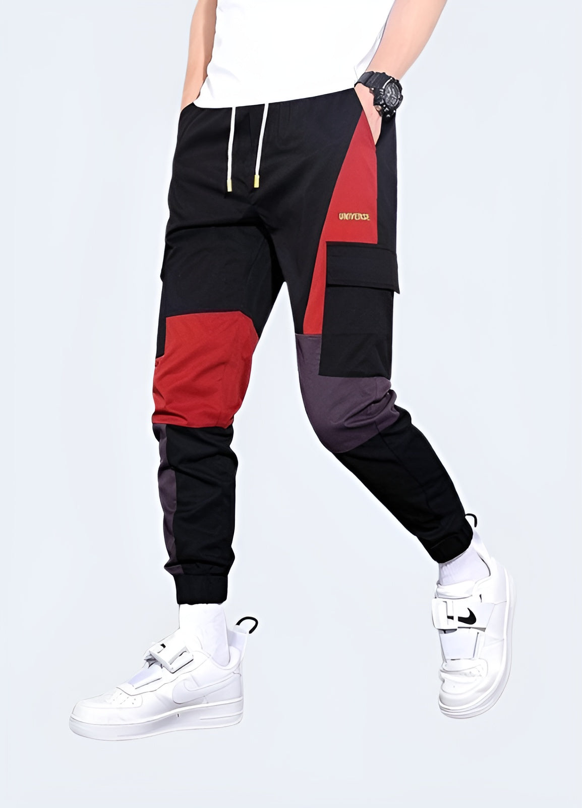 Vibrant red techwear pants featuring advanced materials and functional design, ideal for making a bold statement while staying comfortable in Canadian urban environments.